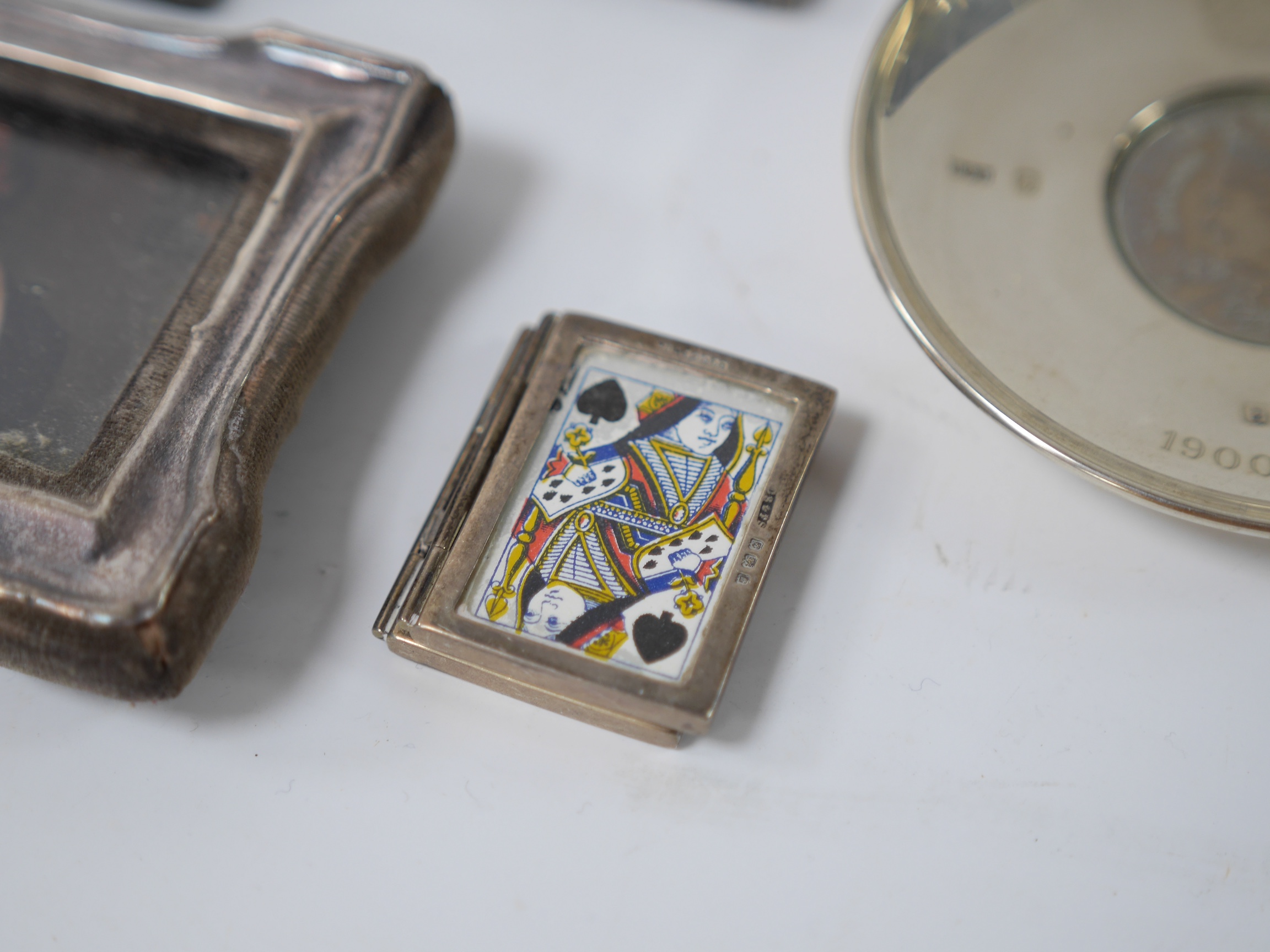 Four small mounted photograph frames, including a double by Saunders & Shepherd, Birmingham, 1905, 45mm, a silver dish, a silver napkin ring and five items of silver flatware. Condition - poor to fair